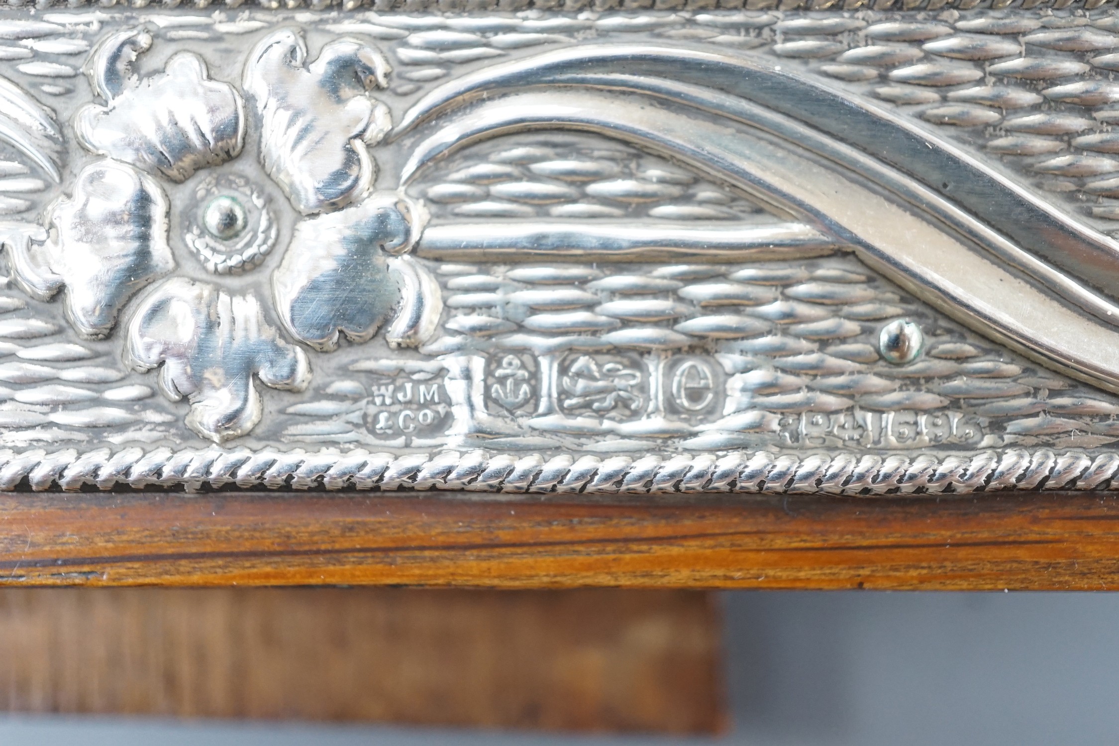 Three assorted early 20th century silver mounted photograph frames, including repousse, Birmingham, 1904, 18.6cm.